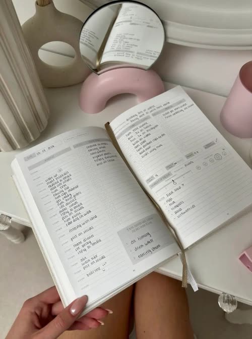 An open planner with a neat handwritten to-do list